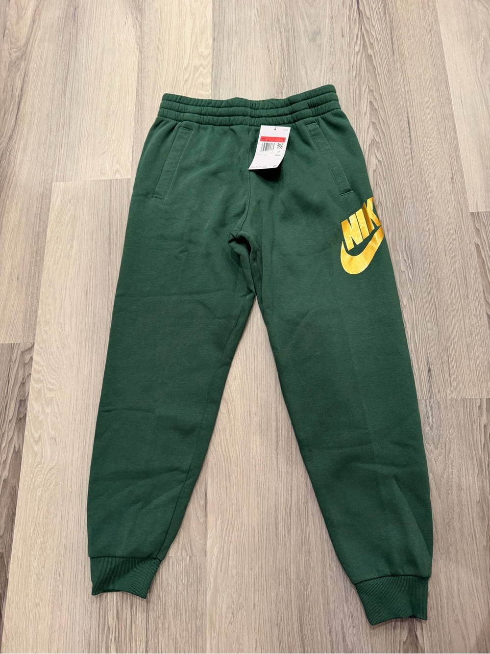 Nike Kids Dark Green Joggers with Gold Logo